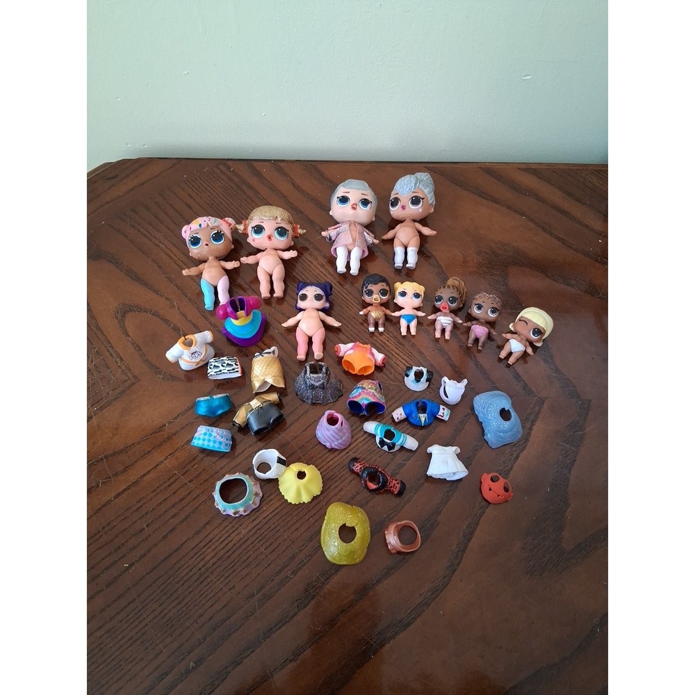 Lot of 10  LOL Surprise Mini Dolls .clothes
